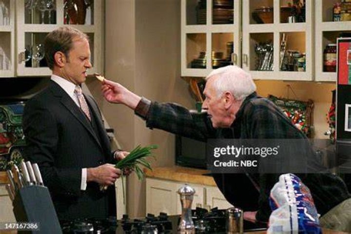 A high Martin Crane stares at the TV screen in Frasier: High Holiday