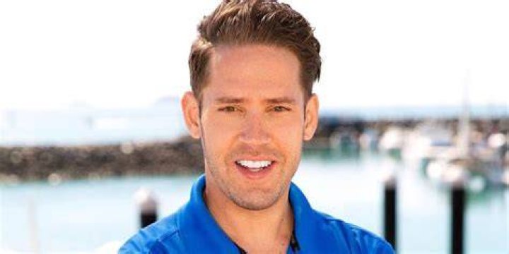 Ryan McKeown smiling in blue polo shirt